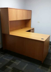 Photo of an L-shaped desk with return and hutch.