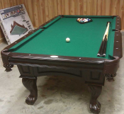 Photo showing a slate pool table in a home recreation room.
